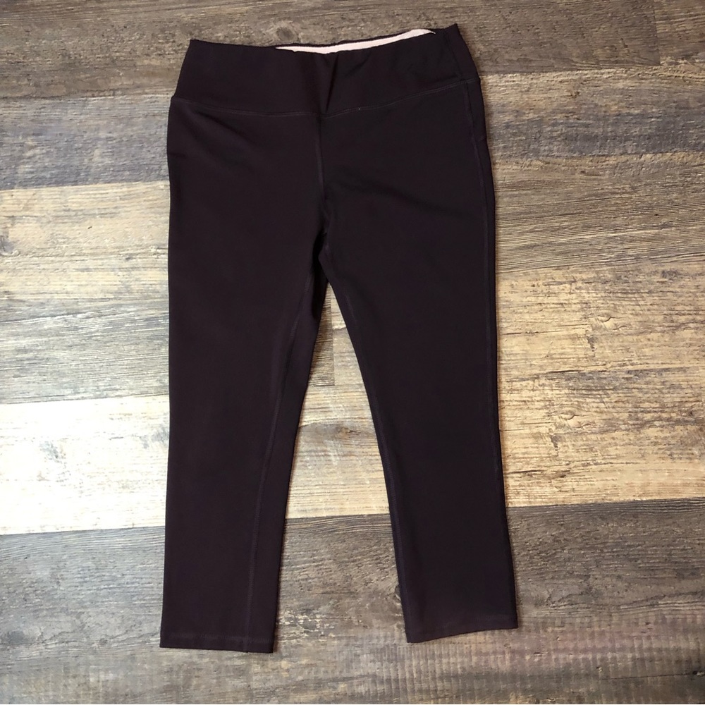 Marika Sport a "Winter Wine" color. 81% Polyester and 19% Spandex EUC